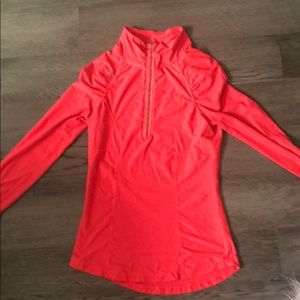 Bright pink running shirt.